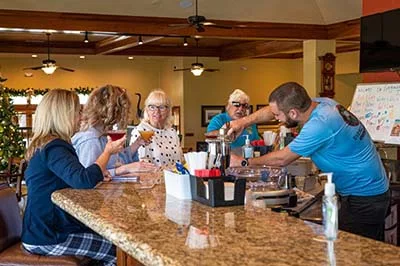 Pouring drinks for happy hour at the Lighthouse Club.